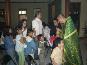 Children Receiving Communion in Indonesia